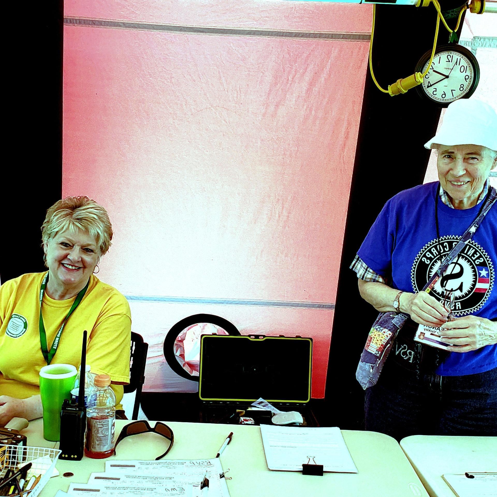 Eleanor Yackley and Kathie Clark manning a booth
